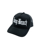 Old English White On Black Foam Front Trucker Hat (Curved Brim)